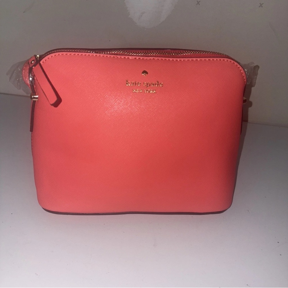Kate Spade Pink Cosmetic Case with Sophisticated Charm